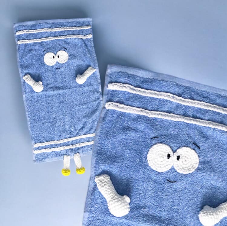 An image of Towlie propped up againsts a blue background with a close-up in the lower right half of the photo.