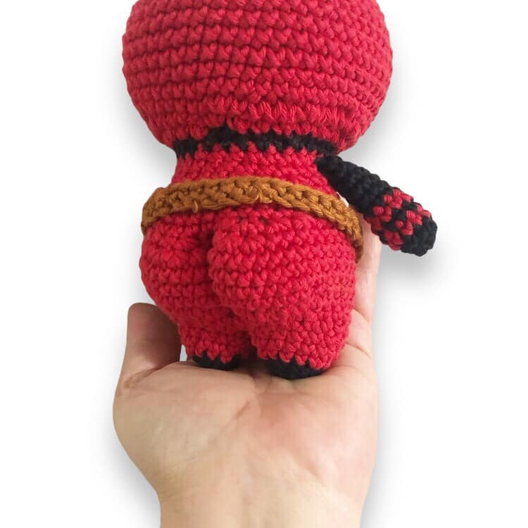 A behind view of the crochet Deadpool showing off the bubble butt.