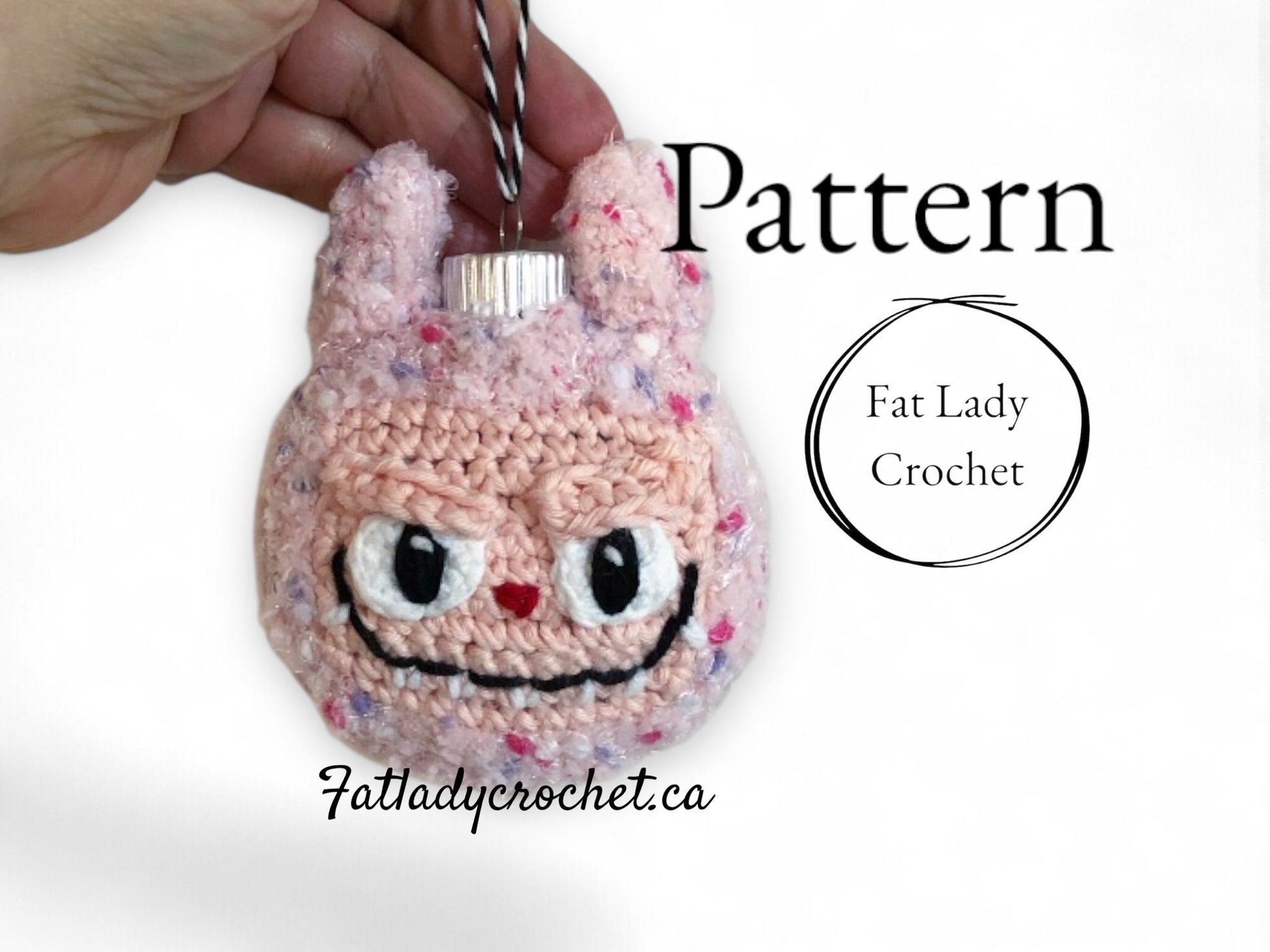 Crocheted pink Labubu ornament with 'Fat Lady Crochet' branding on a white background