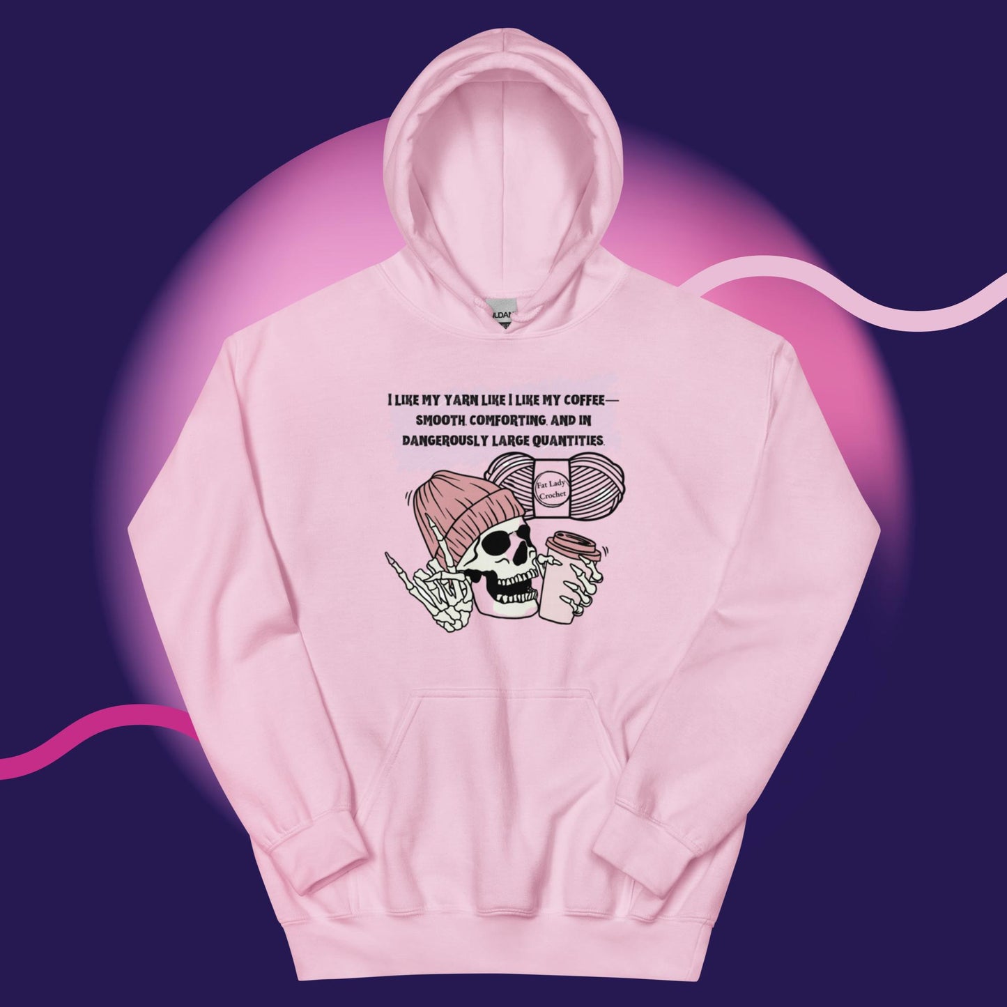 A pink hoodie with a skeleton wearing a dark pink beanie and holding a cup of coffee.