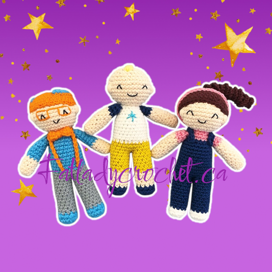 Three crocheted toy figures resembling a child with glasses, a child with a blue and yellow outfit, and a child with a blue and white outfit, all smiling and part of the 'Tiny Tots Trio' pattern pack against a purple background with stars