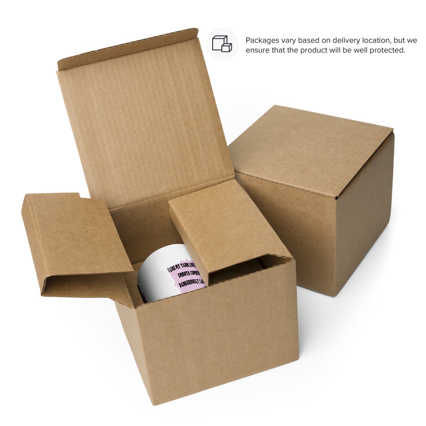 Open cardboard box with coffee and yarn skeleton mug inside on a white background.