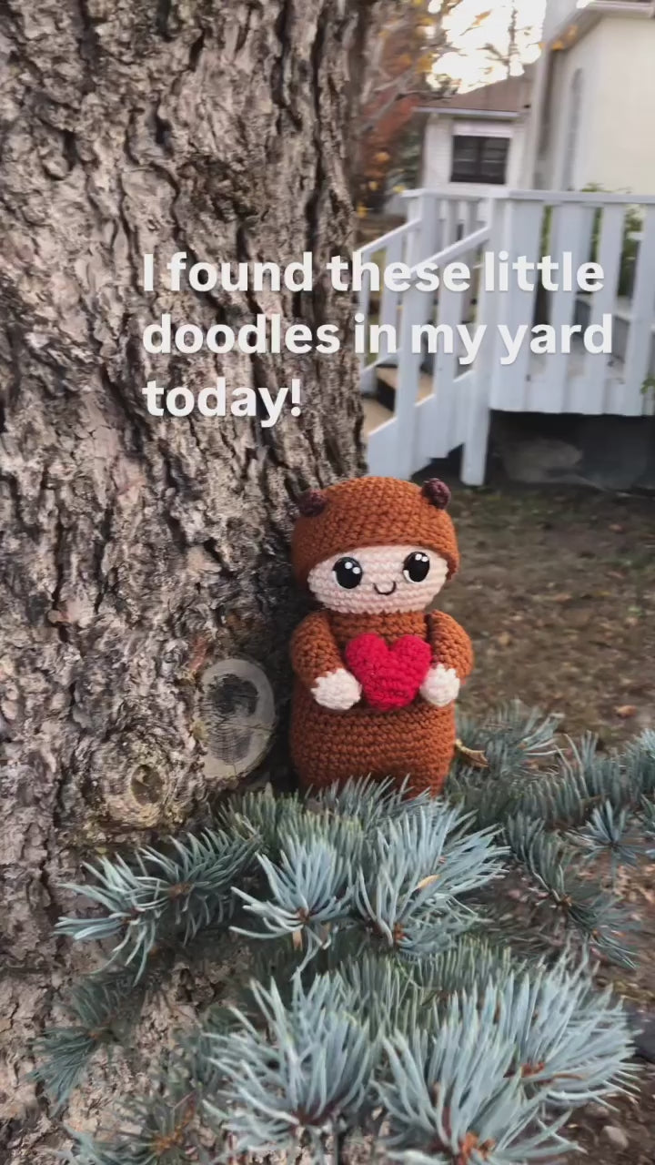 An eleven second video advertising the squirrel dolls in an outside environment.