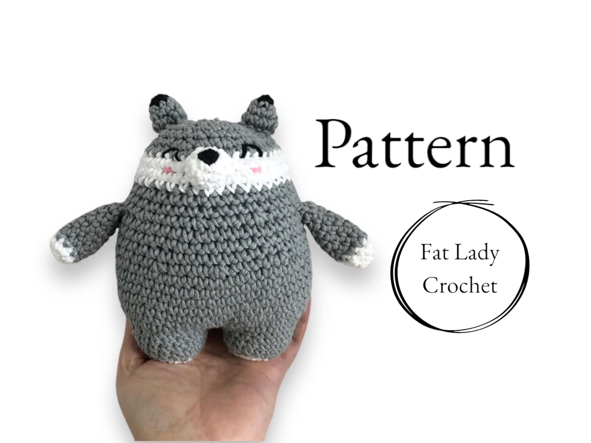 A hand holding a crocheted round wolf, with the text 'PATTERN' and 'FAT LADY CROCHET' visible.