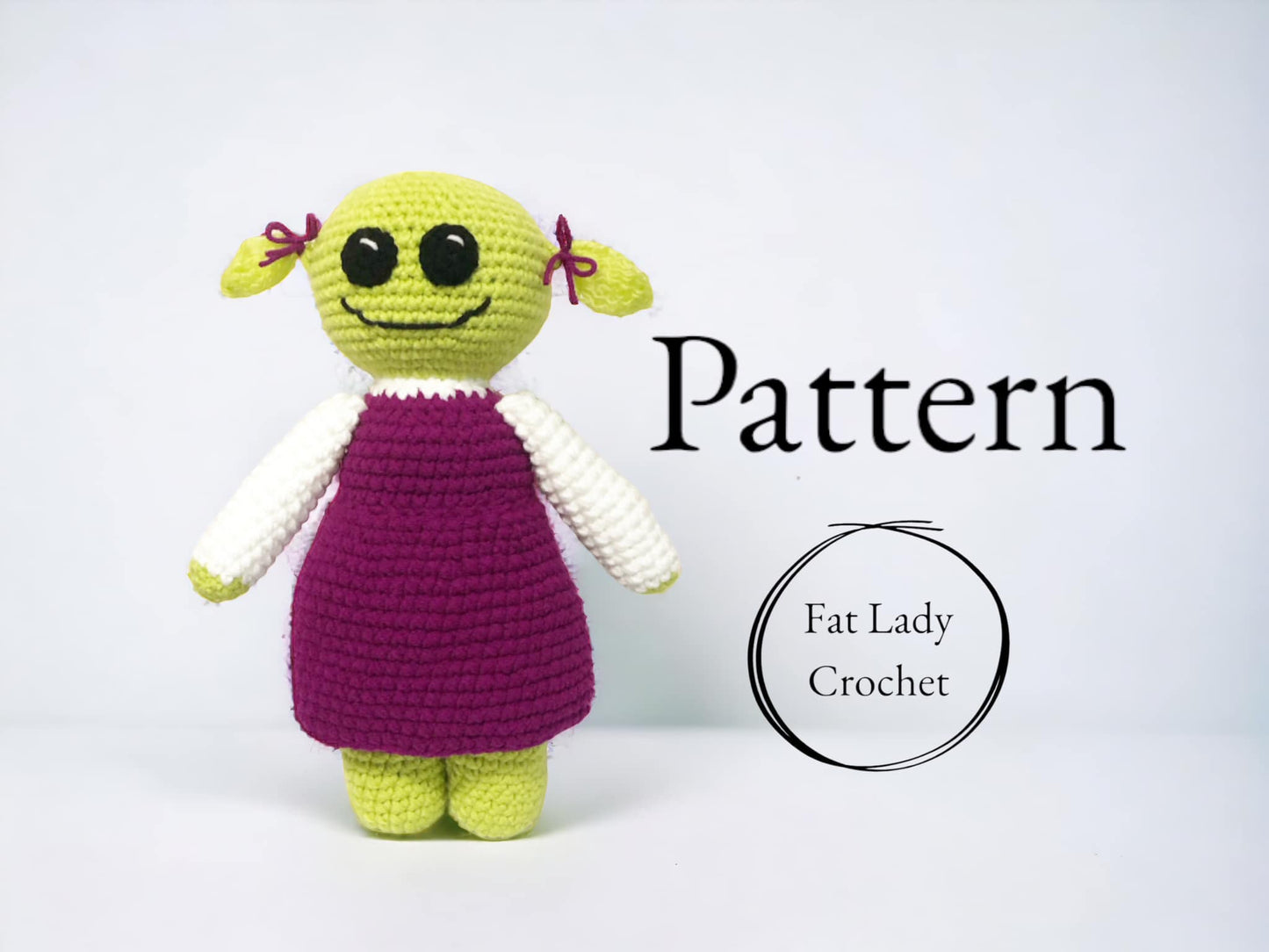 A crochet doll of Mona from Nanalan standing against a white background with text that reads "Pattern," and "Fat Lady Crochet." 