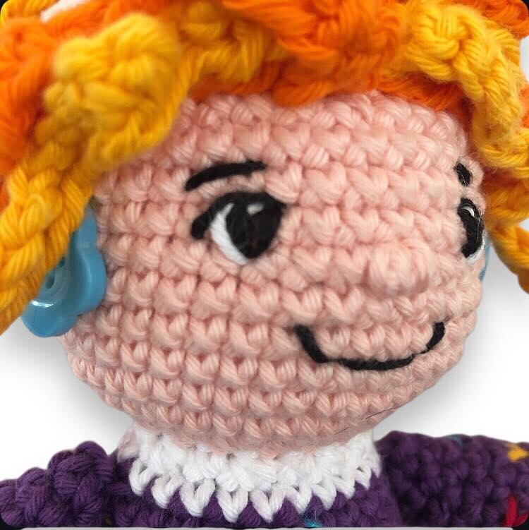 Close-up picture of crocheted Mrs. Frizzle's face
