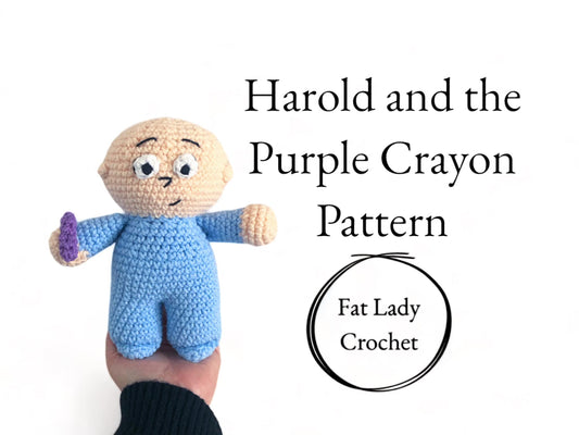 A crocheted doll resembling Harold from Harold and the Purple Crayon being held up against a purple background with text reading "Harold and the Purple Crayon Pattern," and "Fat Lady Crochet." 