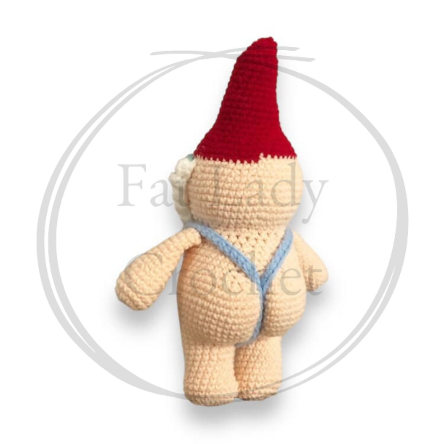 A crochet doll of a gnome in a mankini facing away from the camera showing off the bubble butt. 