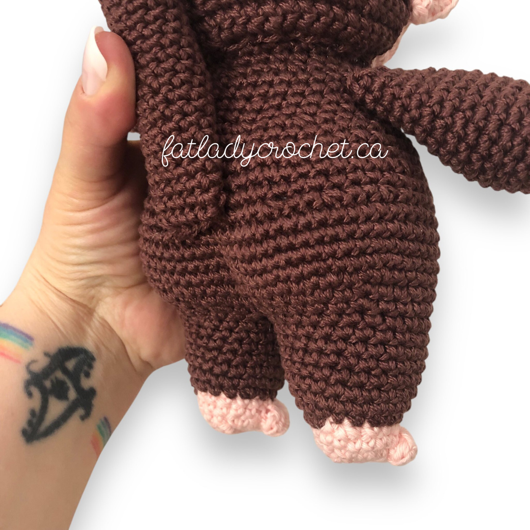 The behind of the crocheted monchhichi doll with bum