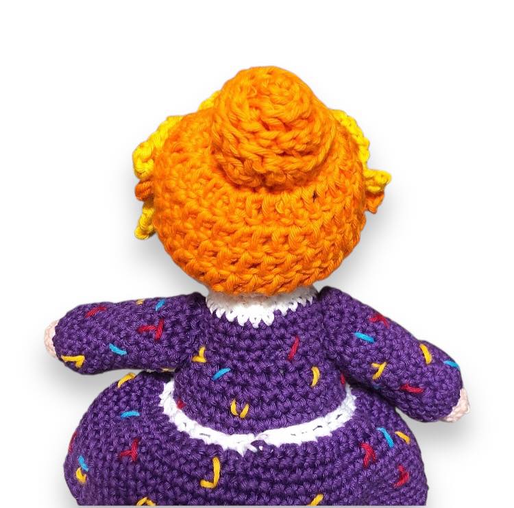 Mrs. Frizzle doll facing away from the camera, showing off the back of the head