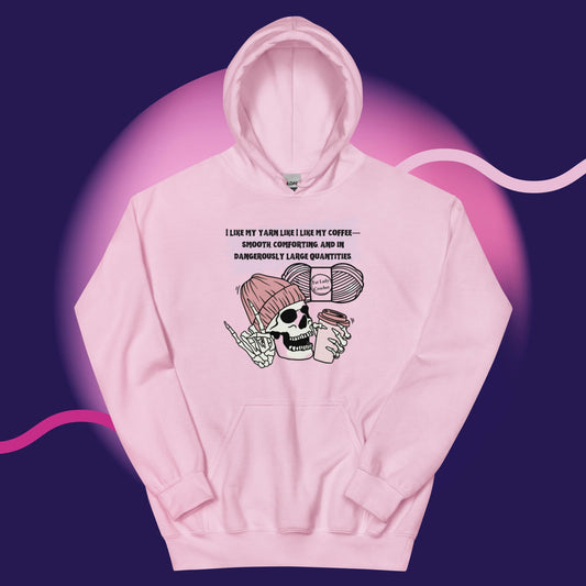 A pink hoodie with a skeleton wearing a dark pink beanie and holding a cup of coffee. 