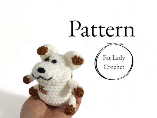 A crocheted plushie resembling Russel from Nanalan being held up against a white background with text that says "Pattern," and "Fat Lady Crochet." 