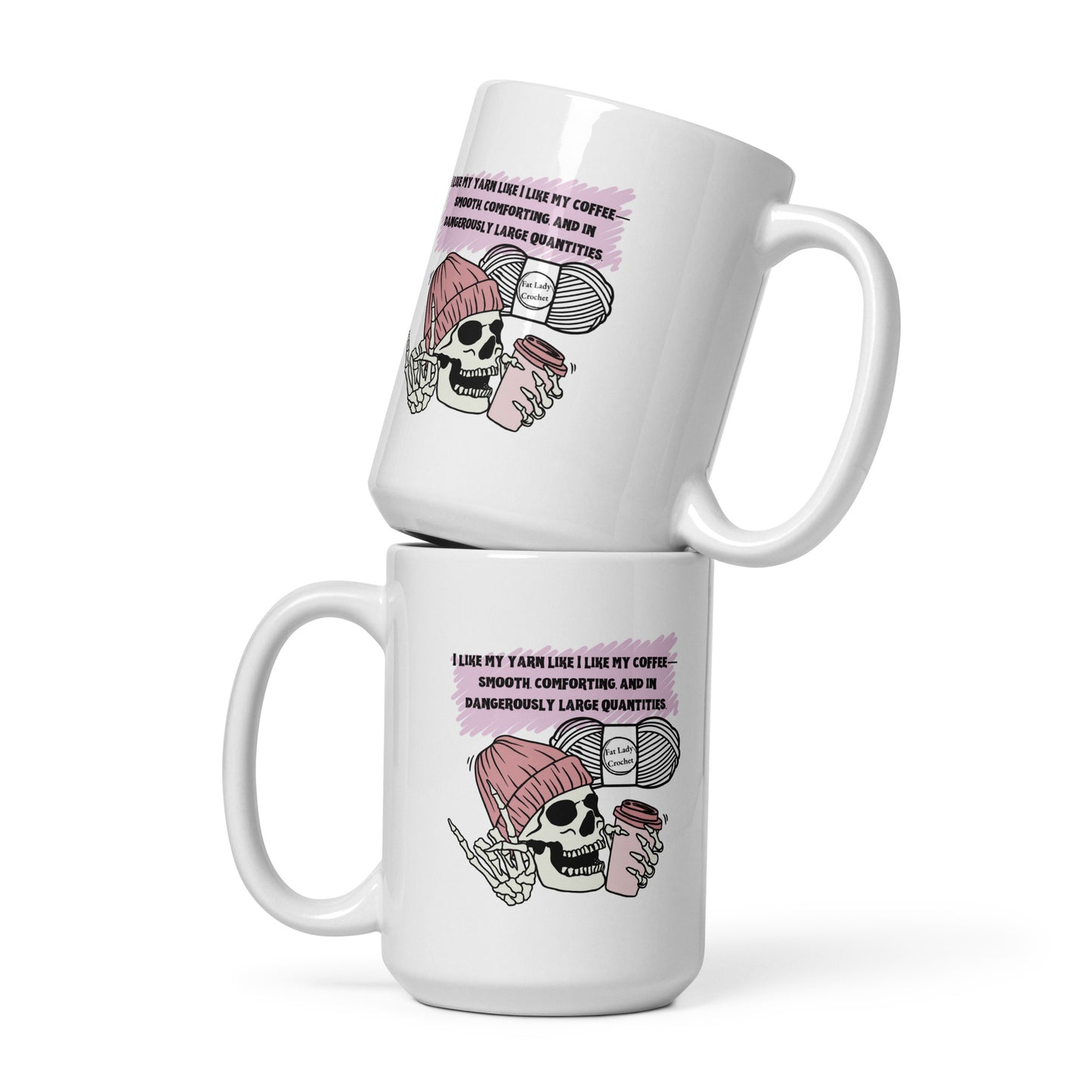 Two mugs stacked on top of each other with the same skeleton in dark pink beanie holding a coffee cup stamped on them. 