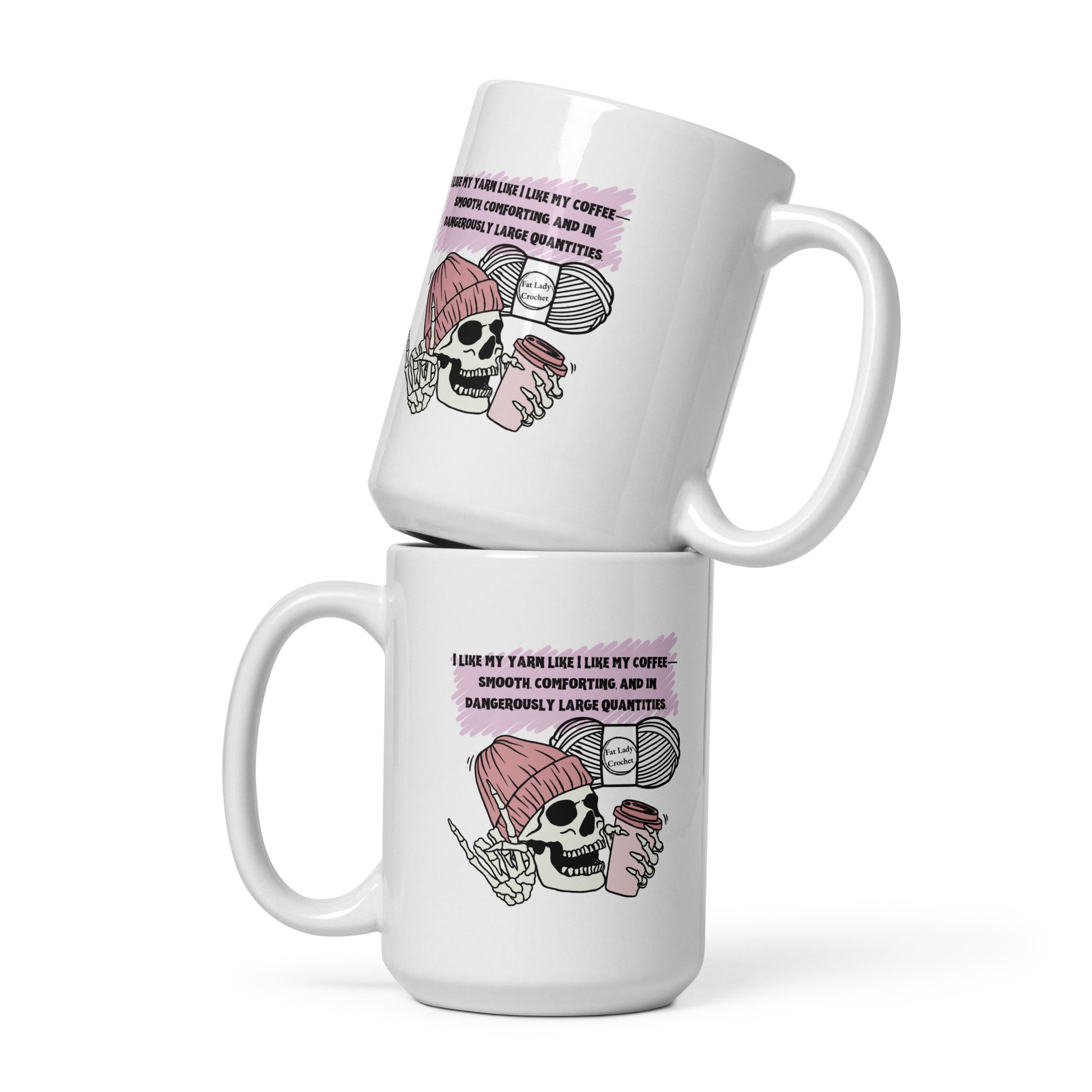Two mugs stacked on top of each other with the same skeleton in dark pink beanie holding a coffee cup stamped on them. 