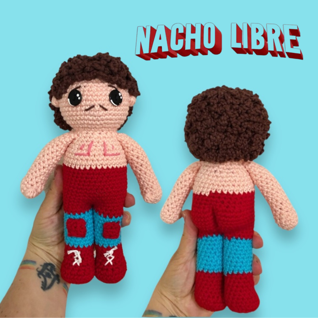 Handmade crochet doll of Ignacio with 'Nacho Libre' text on a blue background