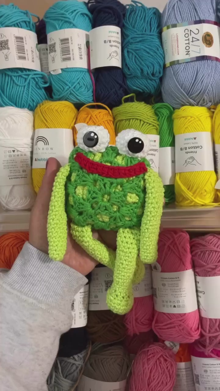 a 20 second video of Mr. Fabu the granny square frog being shown off to the camera against a background of various yarn balls