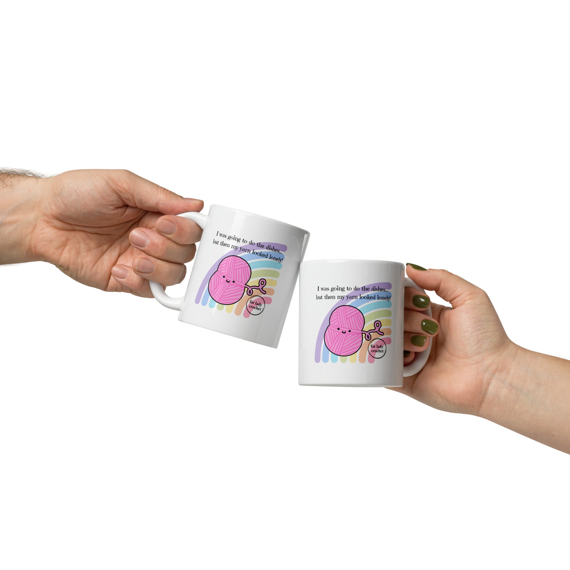 Two people clinking white mugs with pink yarn together. 